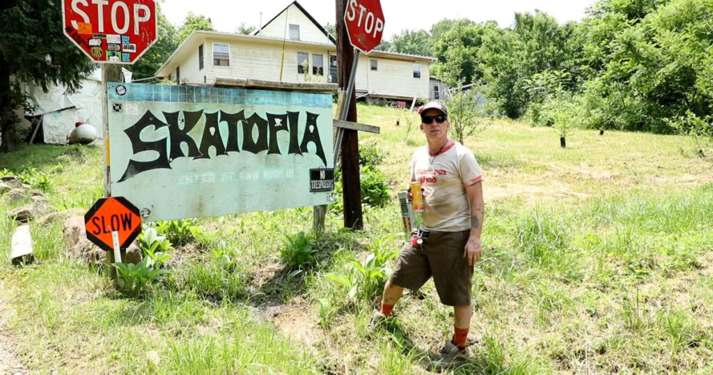 Brewce Martin stands out front of Skatopia sign.
