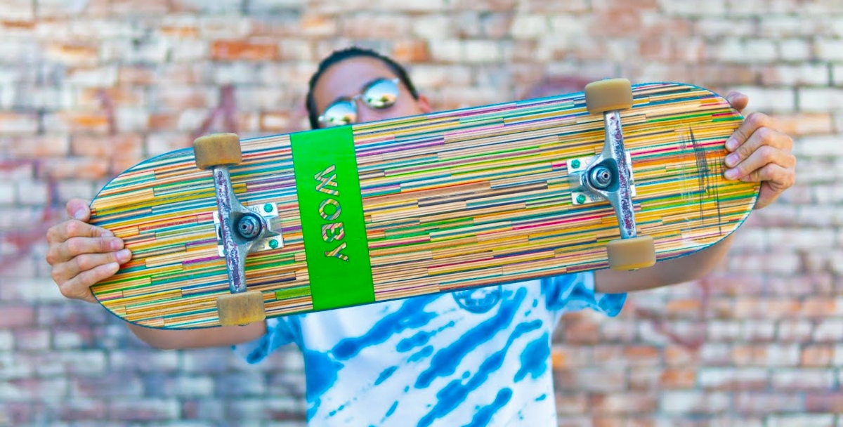man holding a WOBY skateboard