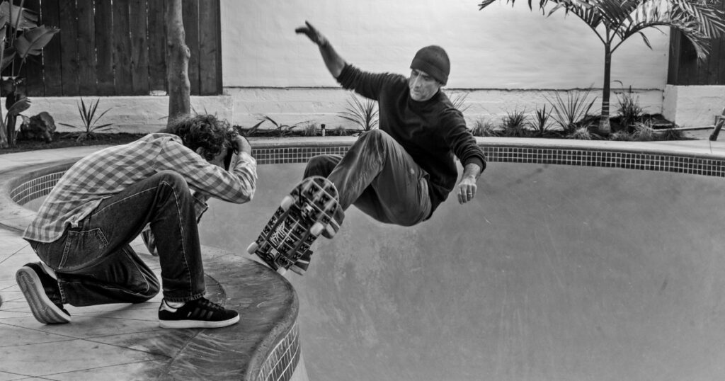Lance Mountain being photographed skateboarding in a pool